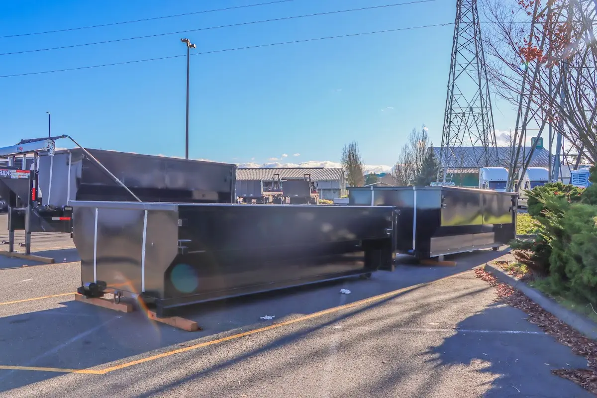 Roll-off dumpster ready for waste disposal at job site for Concrete Dumpster Rental in Hobart